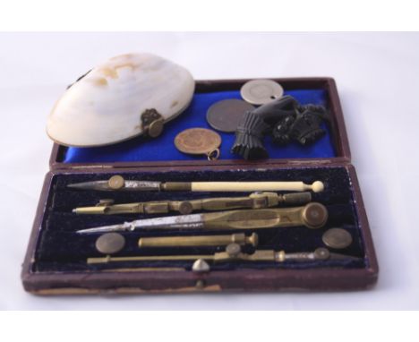 THREE ITEMS, to include a small box of measuring tools, jet brooch and shell trinket box