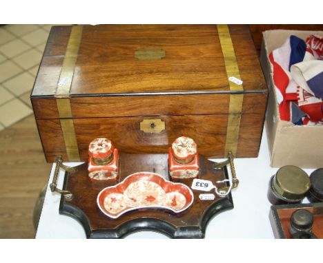 A VICTORIAN BRASS BOUND WRITING SLOPE, with brass escutcheons, fitted interior with two ink bottles, approximately 40cm x 24c
