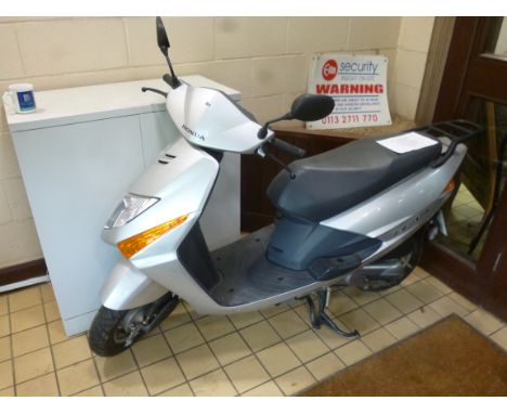 A HONDA MOPED, model SCU 100-F-S 102cc, petrol, silver paint work, Reg No BG57 AEE, current recorded mileage 957, first regis