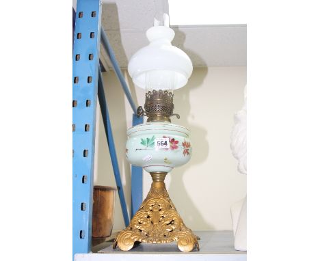 AN OIL LAMP, opaline glass well with floral decoration, glass funnel and shade