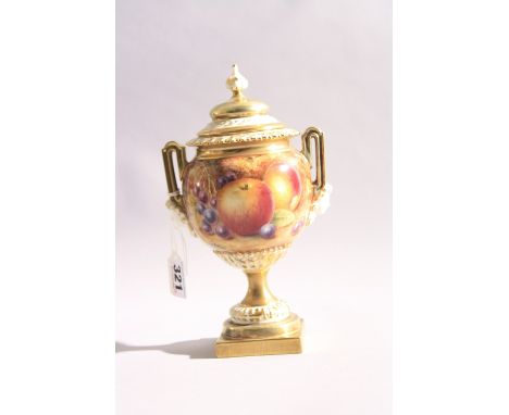 A ROYAL WORCESTER TWIN HANDLED URN AND COVER, hand painted with apple, grapes, peaches and cherries, with gilt and cream high