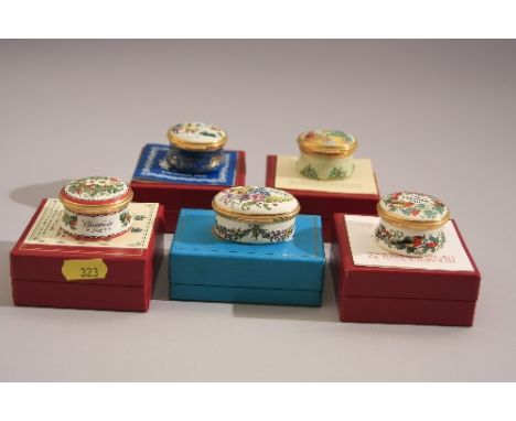 THREE BOXED HALCYON DAYS ENAMEL BOXES, Christmas 1980, 1981 and 1983, together with two boxed Bilston & Battersea enamel boxe