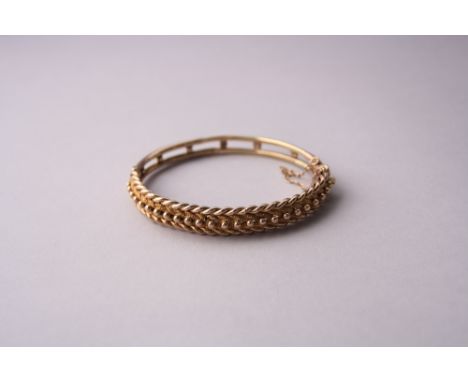 A 9CT ROSE GOLD KEEPER BANGLE, diameter 6.5cm, with safety chain, stamped 9ct