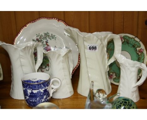 A GROUP OF ROYAL WORCESTER, to include four graduating 'Leaf' jugs (7)