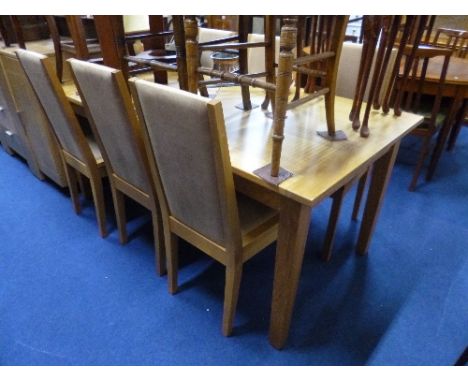 A MODERN LIGHT OAK EXTENDING DINING TABLE, and six matching chairs (7)