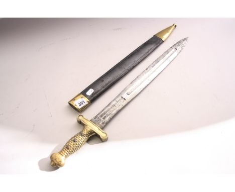 A CAST HAND SWORD, in brass and leather scabbard, marked 2780 on hilt (crossed out) and 203 stamped above scabbard is stamped
