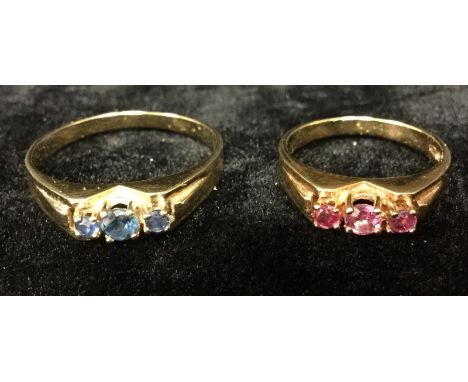 A sapphire trilogy ring, central round cut blue sapphire flanked by a graduated conforming sapphire to each side, 9ct gold sh