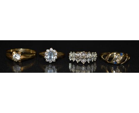 A cubic zirconia solitaire ring, round cut cubiz circonia, six claw set, 9ct gold shank, size V;  other cluster rings;  a ope