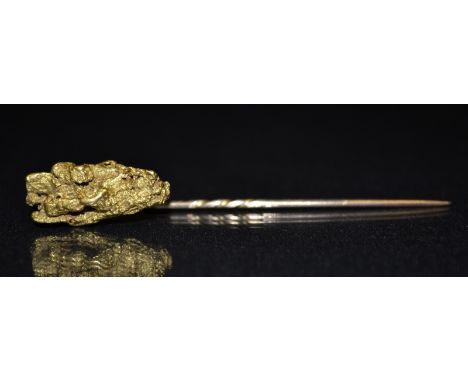 A gold coloured metal tie pin, he terminal mounted with a pure gold nugget, 23mm x  10mm, total weight .4g gross