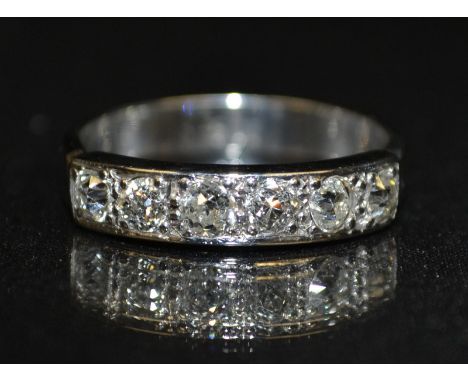 A six stone diamond ring, encrusted with a row of six round brilliant cut diamonds, total diamond weight approx 1ct, 9ct whit