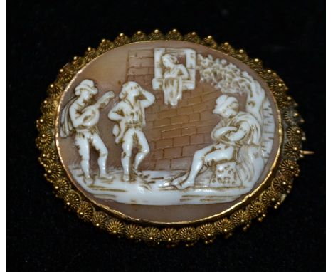 A 19th century hand carved shell cameo brooch, oval panel carved with a lute playing minstrel, maiden and courtiers, unmarked