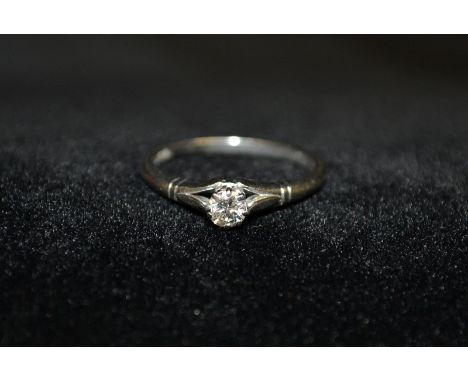 A diamond solitaire ring, round brilliant cut diamond approx 0.20ct, platinum shank, ridged shoulders, size M, 3.7g gross