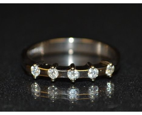 A new five stone diamond half eternity ring, set with five individual mounted round brilliant cut diamonds, total diamond wei