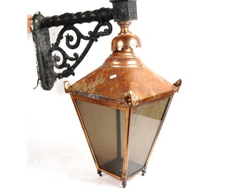 A large copper wall lantern, with cast-iron wall bracket, height 75cm 
