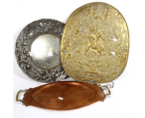 An Art Nouveau copper and brass tray, embossed brass wall plaque, and a spelter-framed convex wall mirror (3) 