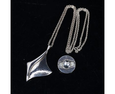 A stylised sterling silver pendant and chain, and a silver brooch 