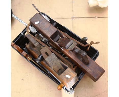 Various woodworking tools, including drills and planes 