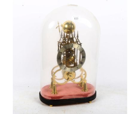 A reproduction brass skeleton clock, Gothic architectural design with silvered chapter ring and Roman numeral hour markers wi