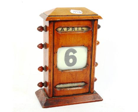 A Vintage oak perpetual desk calendar, height 21cm 