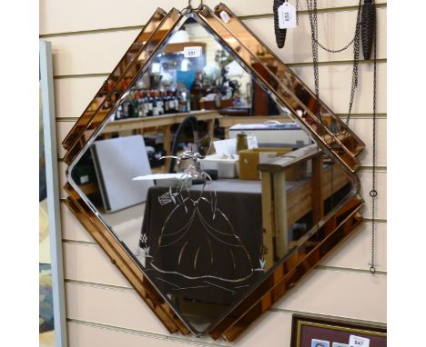 An Art Deco style etched peach and clear glass geometric wall mirror, 72cm x 72cm 