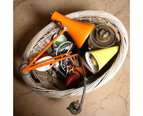 A wicker basket containing Vintage anglepoise lamps 