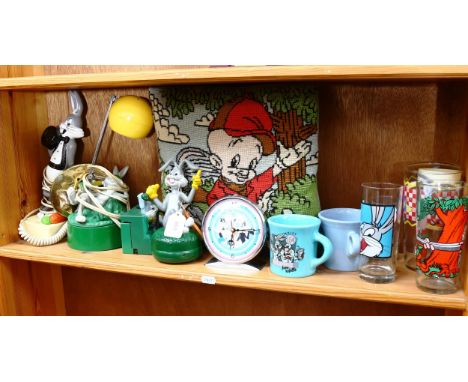 A shelf of Bugs Bunny memorabilia, including a clock and lamp 