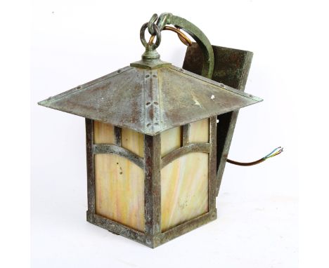 An Arts and Crafts style copper wall lantern, with mottled iridescent glass panels, height 35cm 