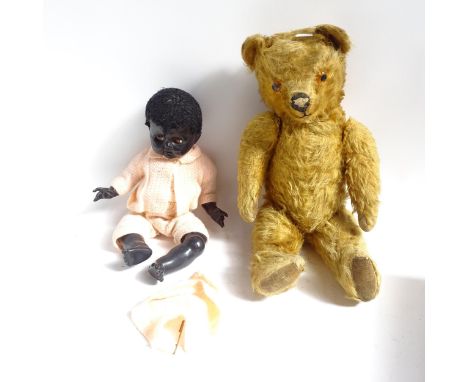 A Vintage straw-filled teddy bear and a Pedigree doll