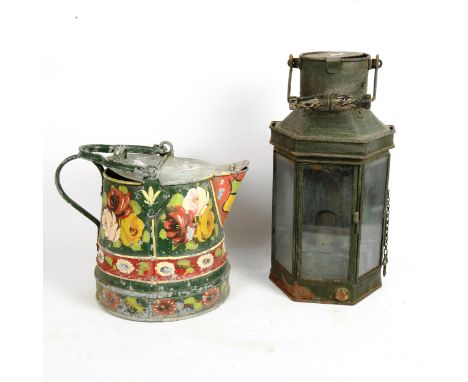 A Barge Ware painted aluminium garden watering can, and a large coaching oil lantern, height 40cm (2) 