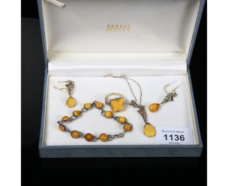 A suite of silver and amber-mounted jewellery, comprising a panel bracelet, ring, pair of earrings and pendant and chain 