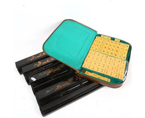 A cased Mahjong set with walls (hinge broken) 