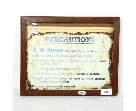 A Vintage A W Bombs Precaution enamel sign, 20cm x 30cm, framed