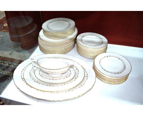 A Royal Worcester 'Gold Chantilly' dinner service comprising: fifteen x 27.5 cm plates; eight x 23 cm plates, nine x 20.5 cm 