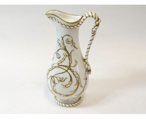VICTORIAN JUG. A Victorian porcelain, gilt decorated jug with rope handle. To the base a moulded Victorian registration mark.