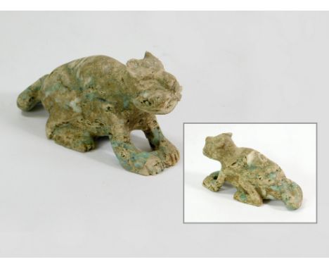 CAT CARVING. An unpolished carved stone cat with green & white jade inclusions (possibly Mexican). Length 9.5cm.  Please note