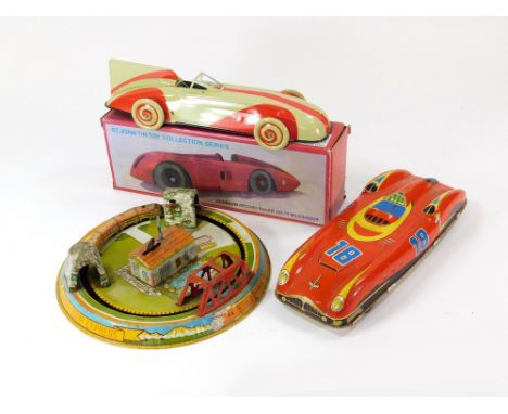 TIN PLATE TOYS. A Marx Toys Honeymoon Express tin plate toy. Diameter 23cm. Also, a tin plate clockwork racing car made in W.