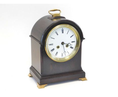 FRENCH CLOCK. A French mahogany domed cased bracket clock, with French movement striking on a bell. The pendulum stamped BTE 