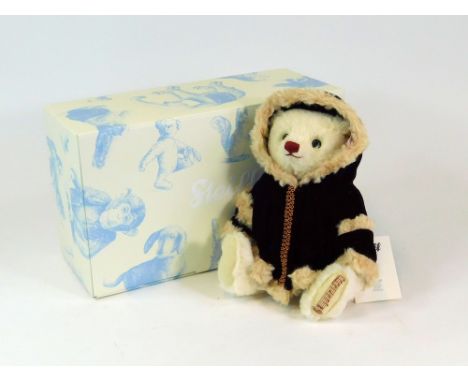 STEIFF. A Steiff 2012 Christmas musical Teddy bear with original ear button, No.1043/2013. Original CoA & inner & outer boxes