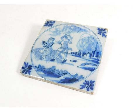 DELFT TILE. A Delft tile decorated with the Devil whipping a sinner. 13 x 13cm.  Please note that all items in this auction a