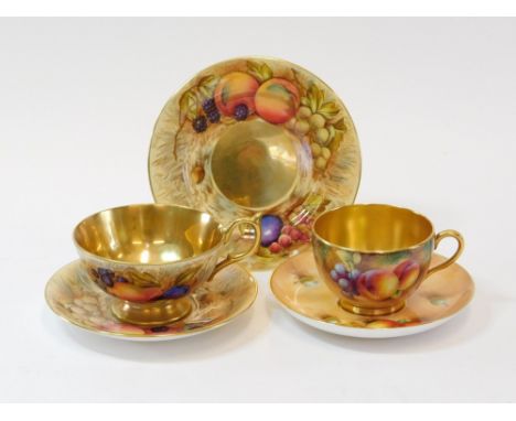 AYNSLEY & ROYAL WORCESTER. An Aynsley Orchard Gold trio, each piece signed by D Jones. Also, a similar Royal Worcester bone c