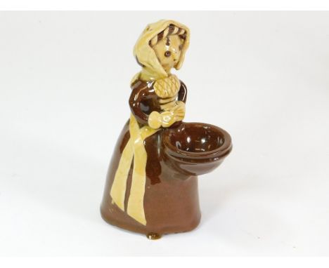 JOHN HUDSON. A slipware salt cellar in the form of a woman by John Hudson. Height 16.5cm.  Please note that all items in this