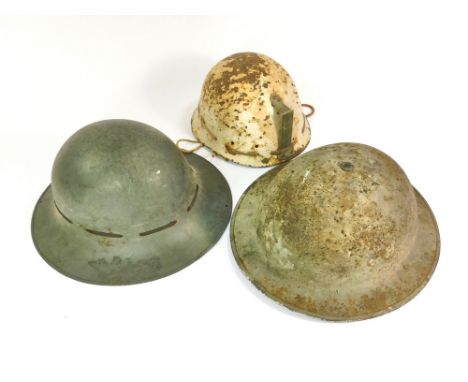 TIN HELMETS. Two World War II vintage steel helmets & a miner's helmet.  Please note that all items in this auction are previ