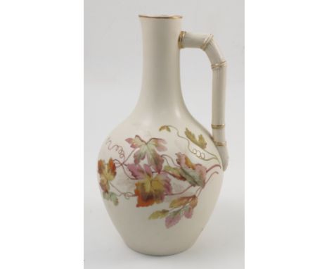 A 19th century Royal Worcester ivory ewer, with bamboo effect handle and decorated with a vine, dated 1880, height 10.5ins Co