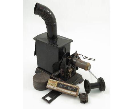 A Bing Germany tin plate projector, together with a boxed set of The Indcol coloured Lantern Slides