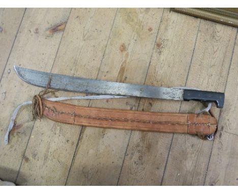 A Collins & Co leg machete, with label and stamp to the blade, having a leather scabbard, total length 29ins