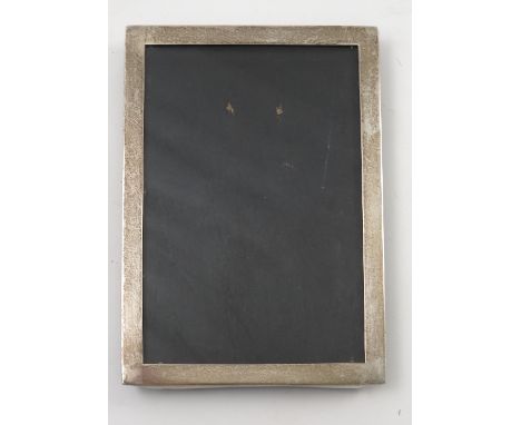 A rectangular silver mounted photograph frame, with wooden back and easel support, Birmingham 1944, picture aperture 6ins x 4