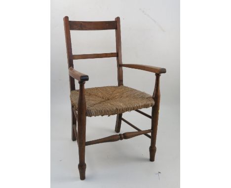 A beech child's chair, with wicker seat, together with a dolls crib, roller skates and various pieces of dolls house furnitur
