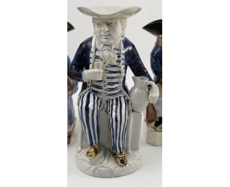 A late 18th century Ralph Wood type Staffordshire toby jug, modelled as Admiral Lord Howe, wearing a tricorn hat, holding a b