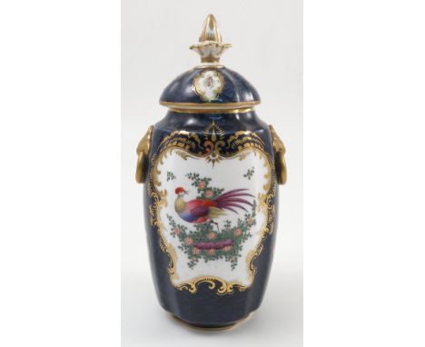 A Grainger and Co Worcester covered vase, the shaped body decorated with reserves of insects and fabulous birds to a scale bl