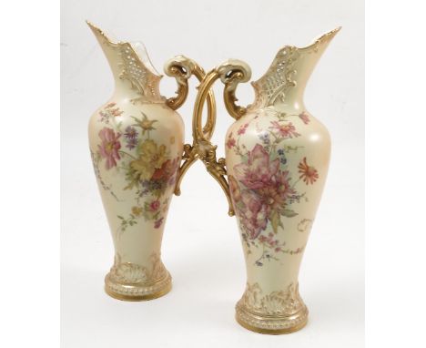 A pair of Royal Worcester blush ivory ewers, decorated with floral sprays, shape number 1587, height 12ins Condition report: 